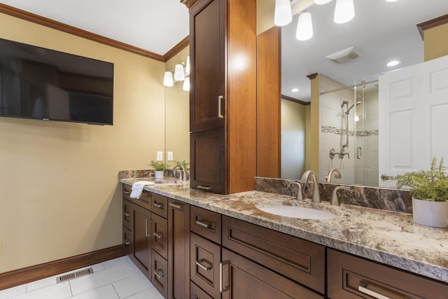 full bathroom with tile patterned floors, visible vents, a stall shower, ornamental molding, and a sink