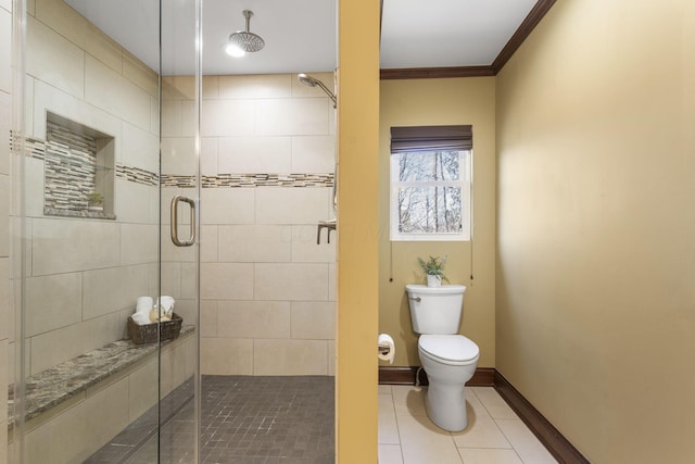 full bathroom with tile patterned flooring, baseboards, toilet, ornamental molding, and a stall shower