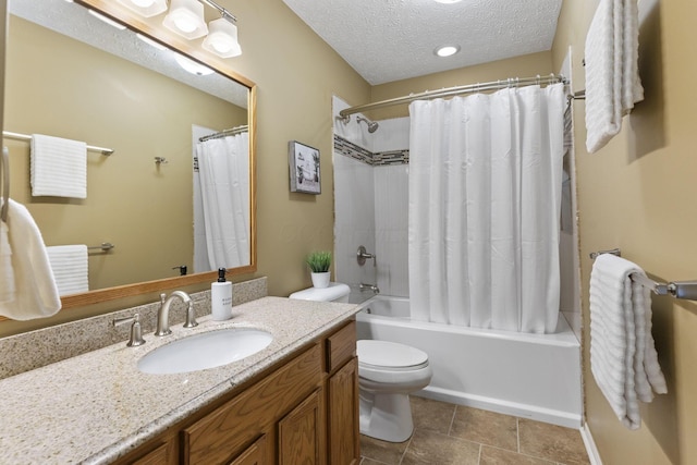 bathroom with shower / bath combo with shower curtain, toilet, a textured ceiling, tile patterned flooring, and vanity