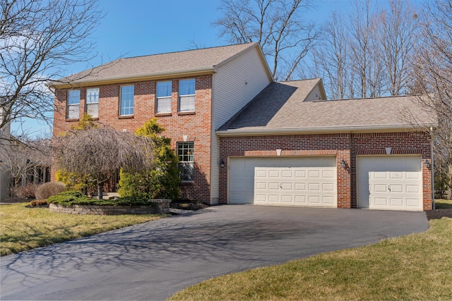 view of front of home with a front lawn, aphalt driveway, roof with shingles, an attached garage, and brick siding