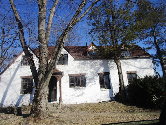 exterior space featuring brick siding