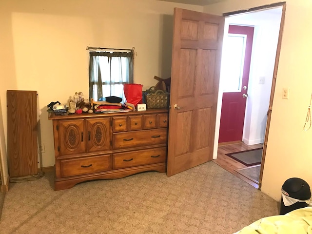 bedroom featuring light colored carpet