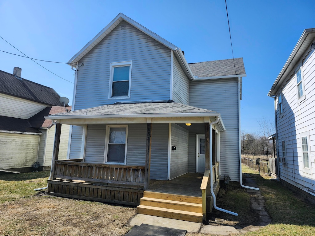 view of front of house featuring covered porch and roof with shingles