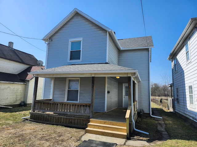 view of front of house featuring covered porch and roof with shingles