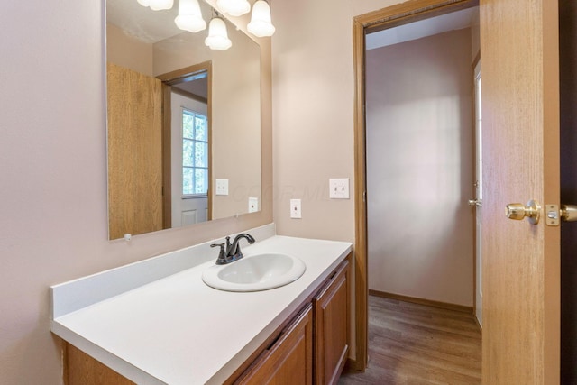 bathroom with vanity and wood finished floors