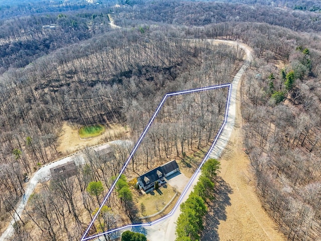 aerial view featuring a view of trees