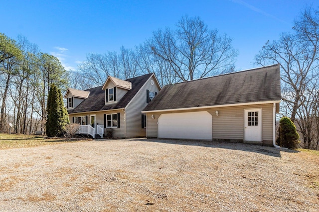 cape cod home featuring a shingled roof