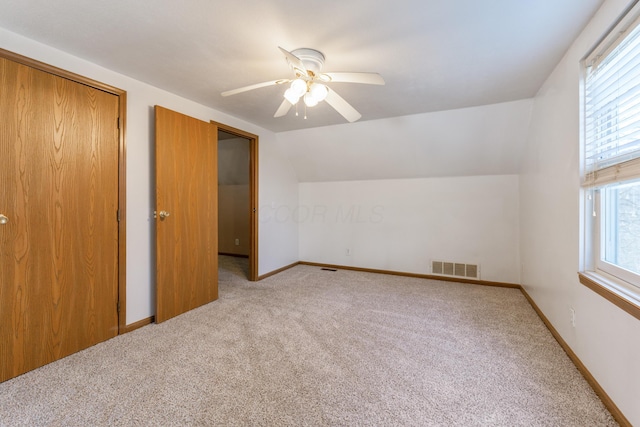 bonus room with visible vents, ceiling fan, baseboards, carpet, and vaulted ceiling