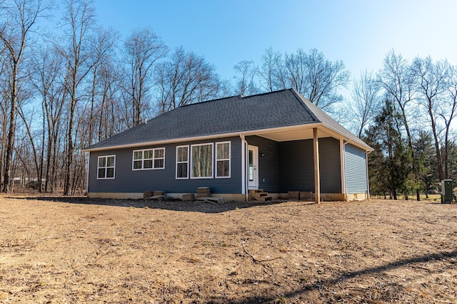 ranch-style house with a shingled roof and entry steps