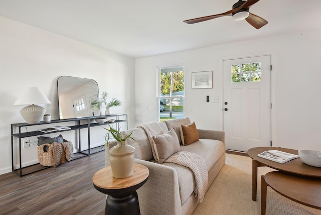 living area with ceiling fan and wood finished floors