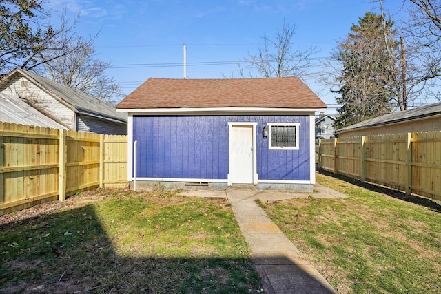 view of outbuilding featuring an outdoor structure and a fenced backyard