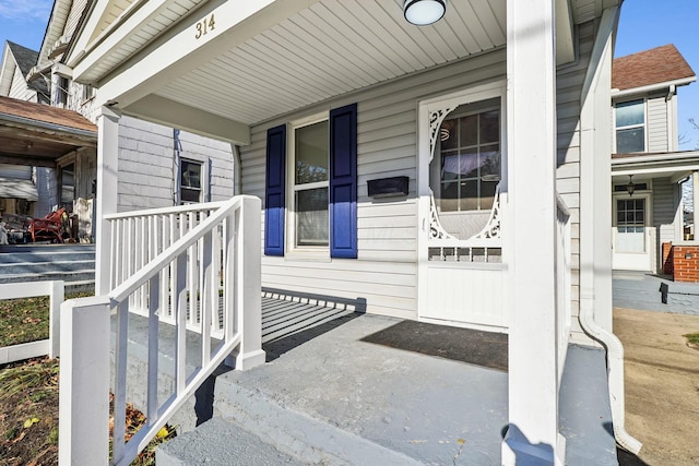 doorway to property featuring covered porch