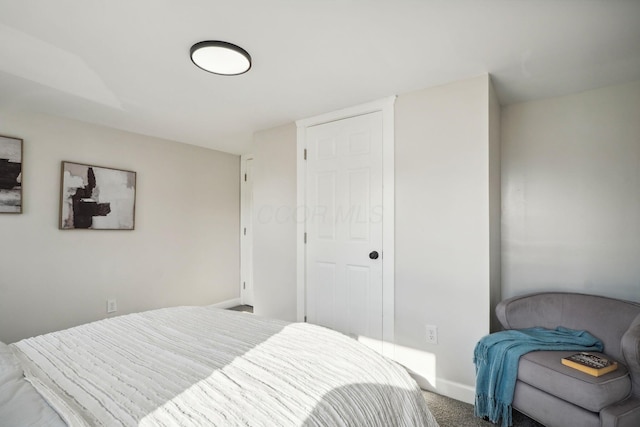 carpeted bedroom with baseboards