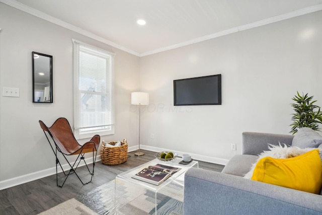 living room with crown molding, wood finished floors, and baseboards