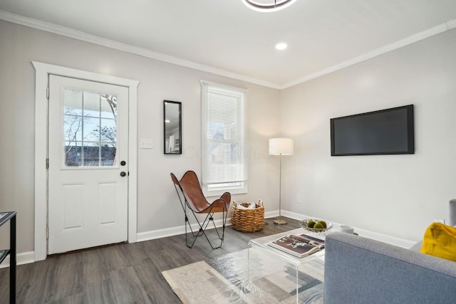 foyer entrance with baseboards, a healthy amount of sunlight, dark wood-style flooring, and ornamental molding