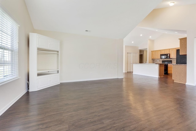 unfurnished living room featuring dark wood-type flooring, baseboards, and high vaulted ceiling