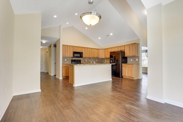 kitchen with black appliances, a kitchen island with sink, backsplash, baseboards, and dark wood-style flooring