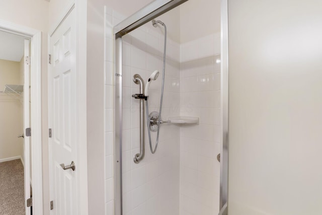 full bath featuring a shower stall