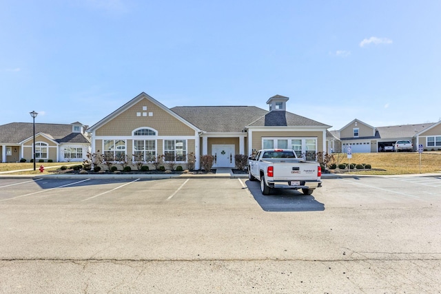 view of property featuring uncovered parking