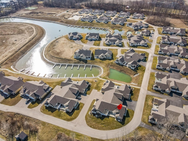 aerial view with a residential view and a water view