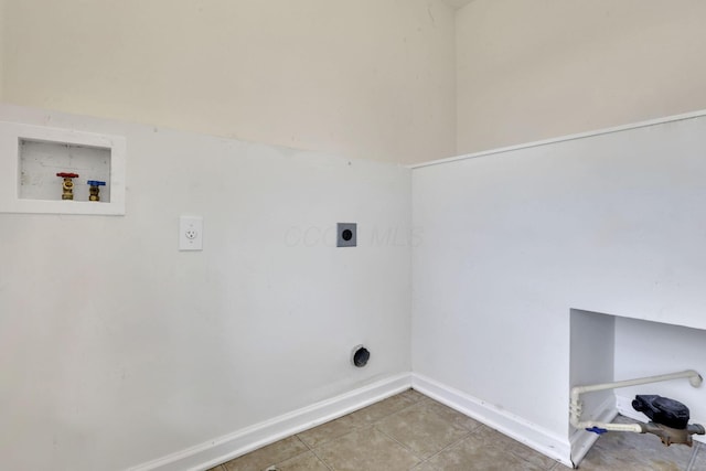 washroom with hookup for a washing machine, baseboards, hookup for an electric dryer, laundry area, and tile patterned flooring