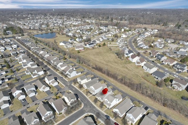 birds eye view of property with a residential view and a water view