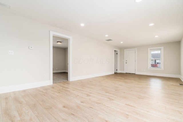 unfurnished room with recessed lighting, visible vents, and light wood-style flooring