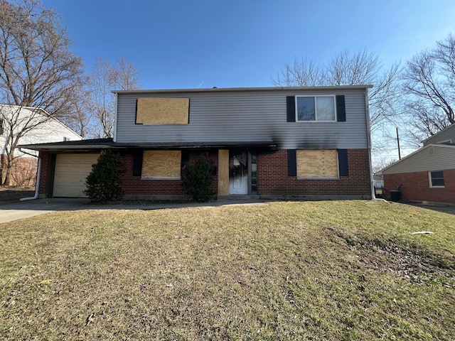 traditional home featuring brick siding, a garage, driveway, and a front lawn