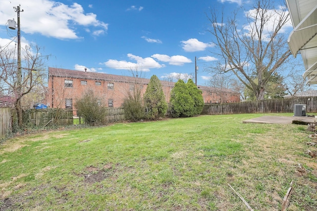 101 Cherokee Dr, Westerville, OH 43081 - view of yard featuring central AC unit, a fenced backyard, and a patio area
