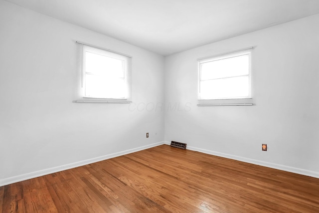 101 Cherokee Dr, Westerville, OH 43081 - spare room with a wealth of natural light, visible vents, wood finished floors, and baseboards
