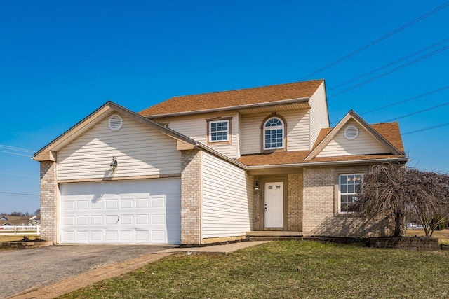 traditional home with a front lawn, aphalt driveway, a shingled roof, a garage, and brick siding