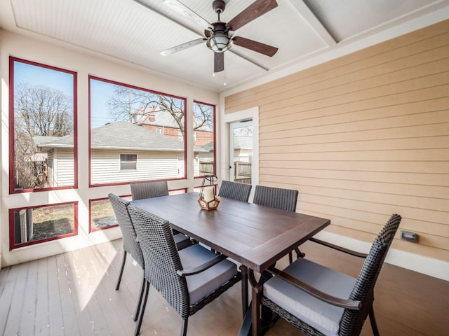 sunroom with a ceiling fan