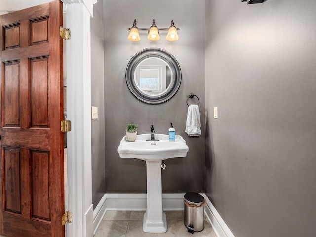 bathroom with tile patterned floors and baseboards