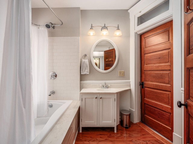 full bath with vanity, wood finished floors, and shower / bath combo with shower curtain