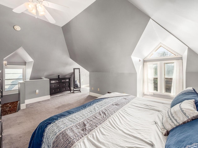 bedroom with lofted ceiling, carpet, baseboards, and ceiling fan