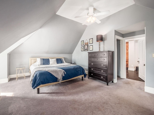 bedroom with baseboards, carpet, ceiling fan, and vaulted ceiling