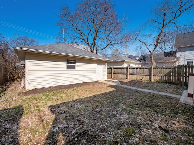 view of yard with an outdoor structure and a fenced backyard