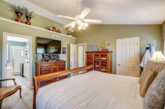 carpeted bedroom with vaulted ceiling, connected bathroom, visible vents, and ceiling fan