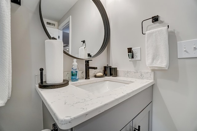 bathroom featuring visible vents and vanity