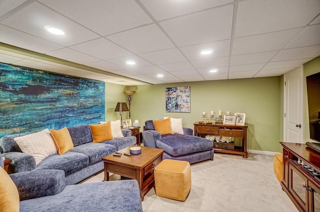 living room featuring recessed lighting, light colored carpet, and baseboards