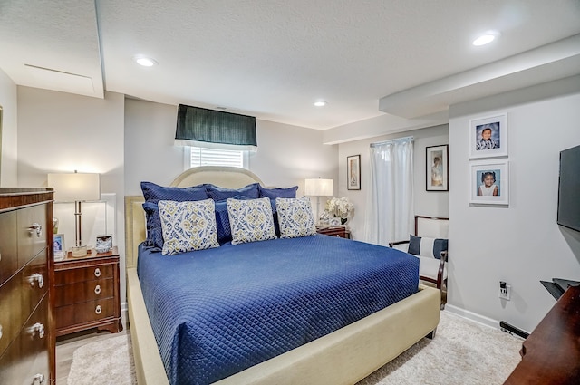 bedroom featuring recessed lighting and a textured ceiling