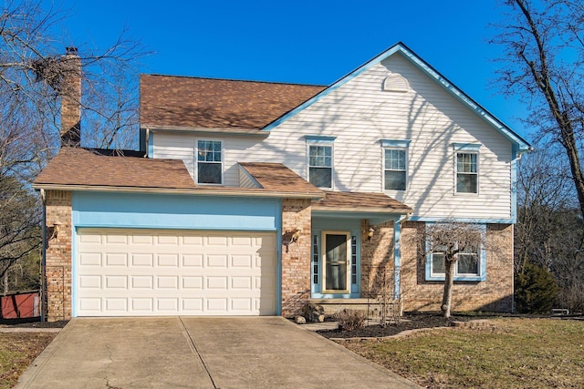 traditional-style home featuring a garage, driveway, and roof with shingles