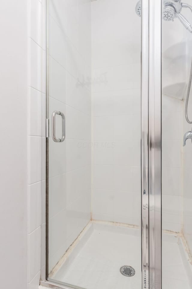 bathroom featuring a stall shower