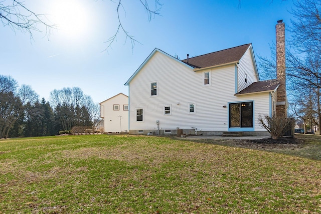 back of house with a yard