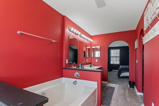 bathroom with a sink and a bath