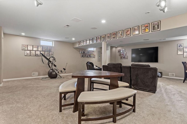 dining space featuring visible vents, baseboards, and light colored carpet