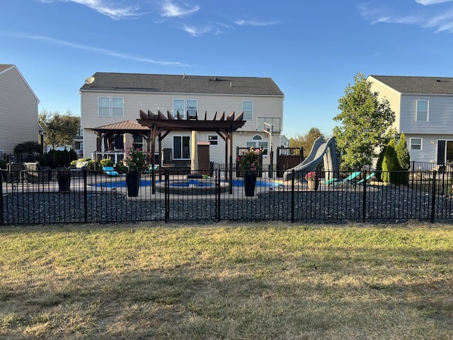 back of house featuring a fenced in pool, fence, a yard, a pergola, and a patio