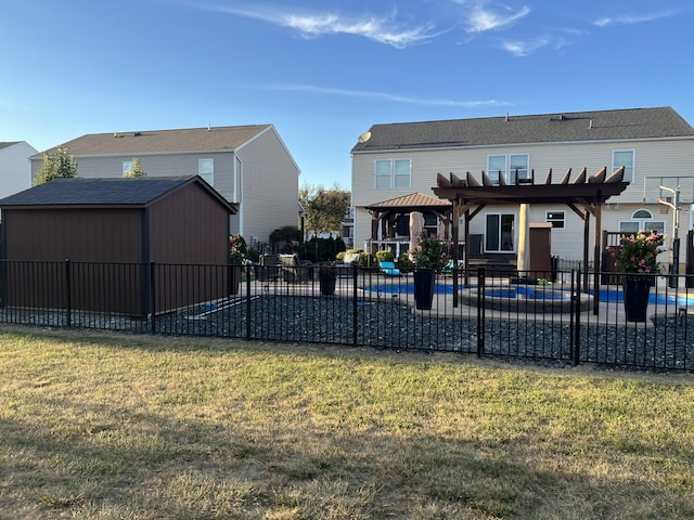 rear view of property with fence, a patio area, a pergola, and a lawn