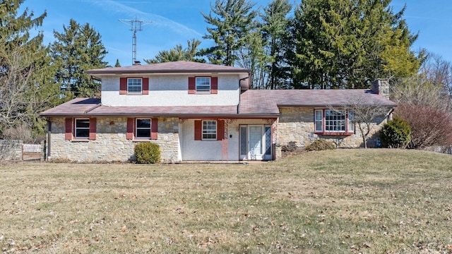 view of front facade featuring stone siding, a chimney, and a front yard