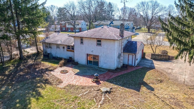 rear view of house featuring a patio, fence, and a residential view